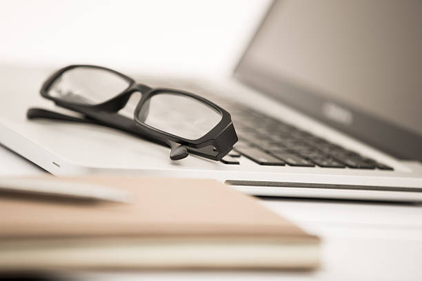 istock Businessman analyzing investment charts with laptop 498809473
