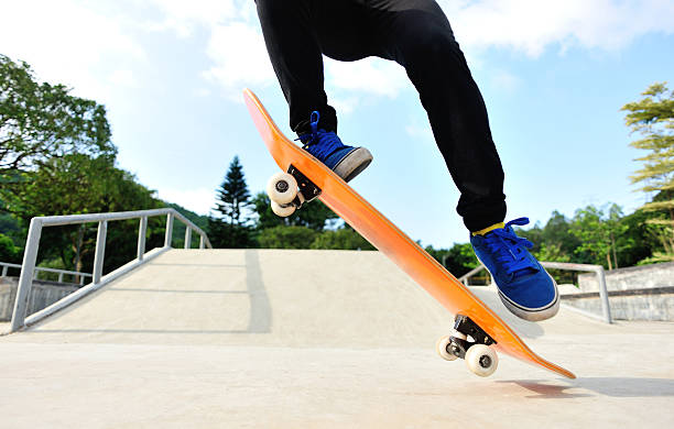 istock skateboarder jump at skatepark 498810139