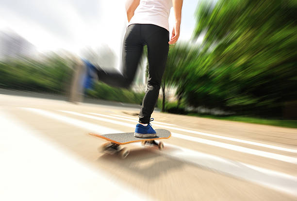 istock speeding skateboarding woman 498810635