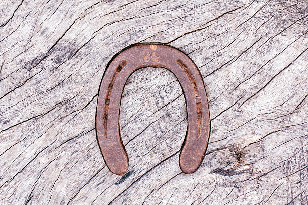 istock Wooden table top with a horseshoe decor 498827997