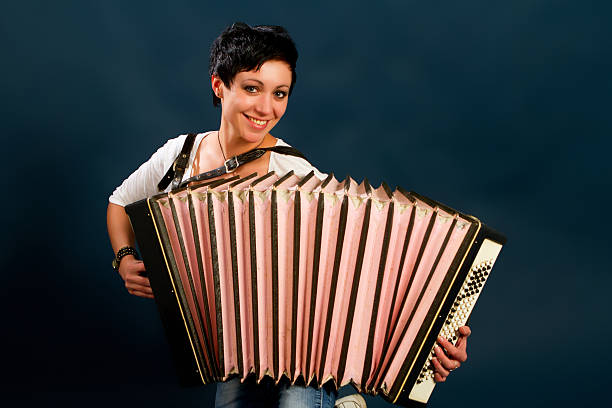 istock brunette with assordion 498828141