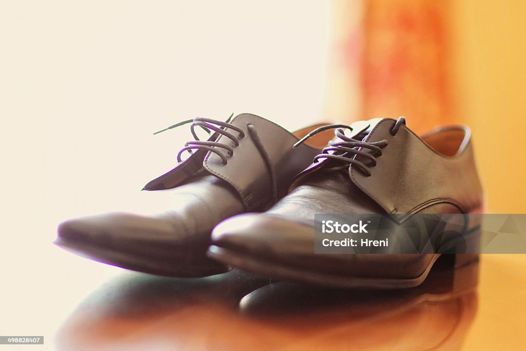 Man brown footwear black Man brown footwear black wedding shoes Adult Stock Photo