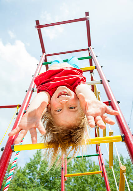 istock Happy child on a jungle gym 498828803