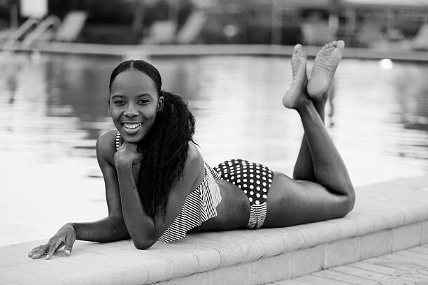 istock Stock image woman laying by the pool 498829759