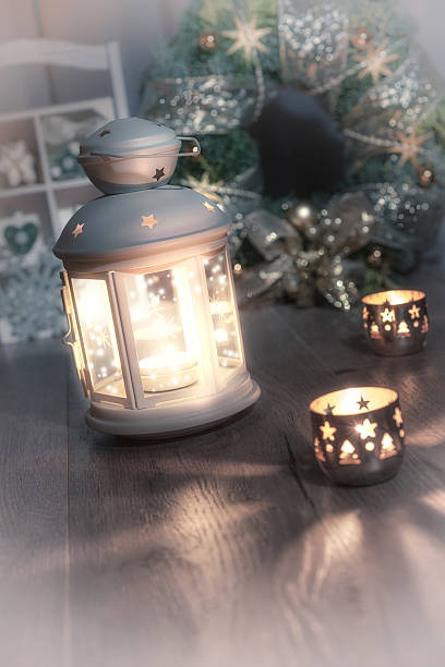 istock Decorative lantern, candles and Christmas wreath on vintage kitc 498830448