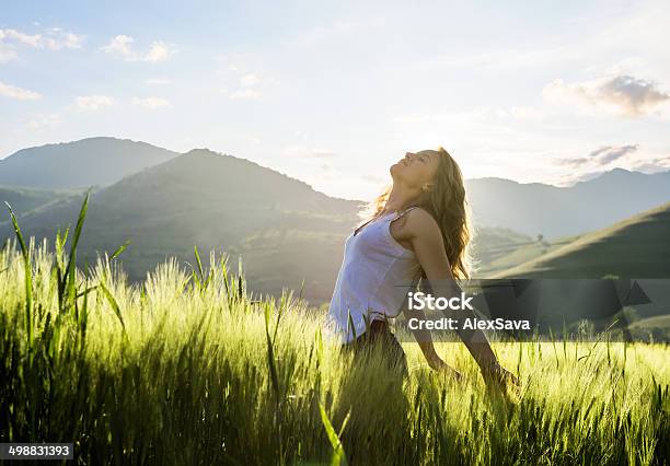 One Young Woman Relaxing Outoors Stock Photo - Download Image Now - Women, Nature, Looking Up