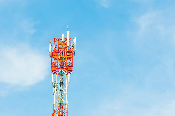 istock Red and White Telecommunication tower with blue sky  cloud 498831435