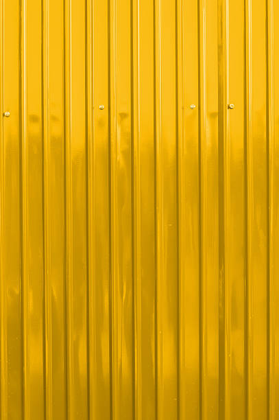 istock yellow color corrugated metal sheet as background 498831449