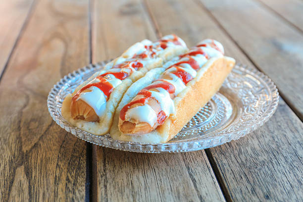 istock Two appetizing hotdog with mustard and ketchup, close up 498831995