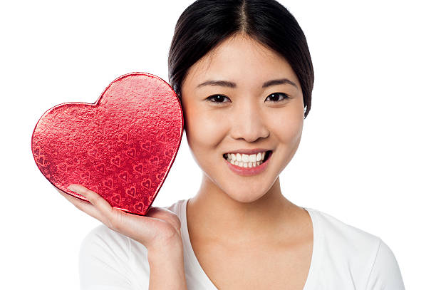 istock Woman displaying her valentine gift 498832535
