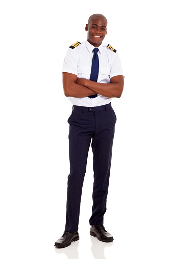 handsome african airline captain with arms crossed isolated on white background