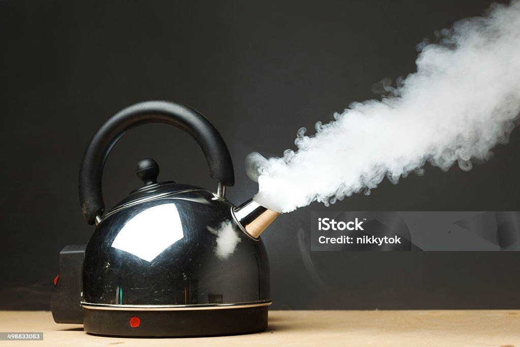 boiling kettle boiling kettle with dense steam Kettle Stock Photo
