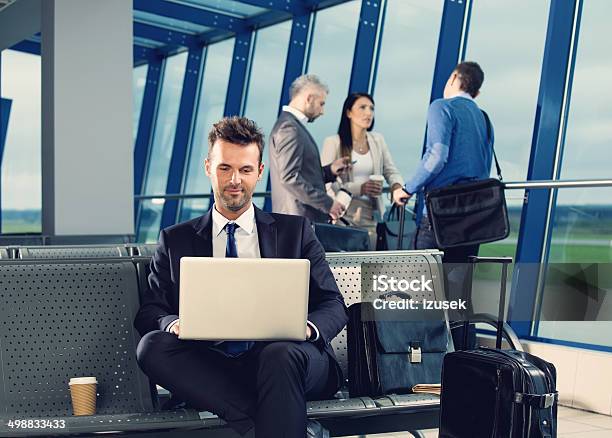Businessman At The Airport Stock Photo - Download Image Now - Airport, Businessman, Busy
