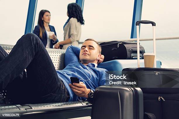 Waiting For The Flight Stock Photo - Download Image Now - Airplane, Headphones, Airport Departure Area