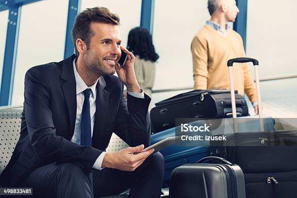 Man On Phone At The Airport Stock Photo - Download Image Now - Airport, Businessman, Business