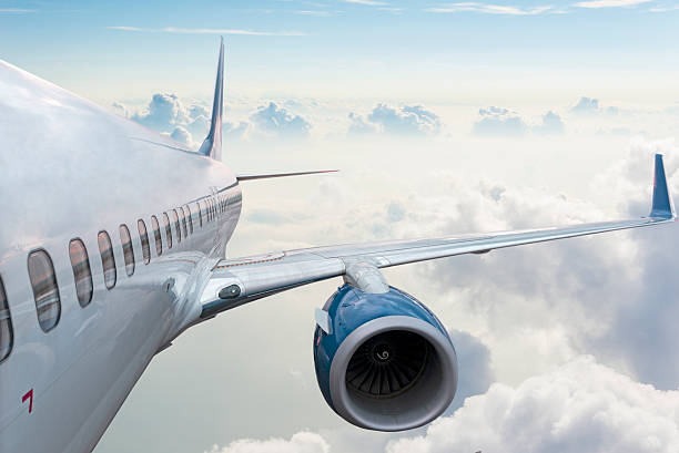 istock Body of an Airplane Flying Above Cloud 498834026