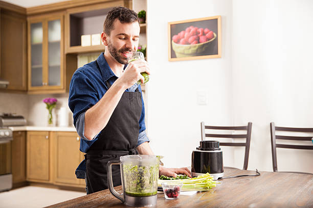 istock Drinking a green smoothie at home 498834506