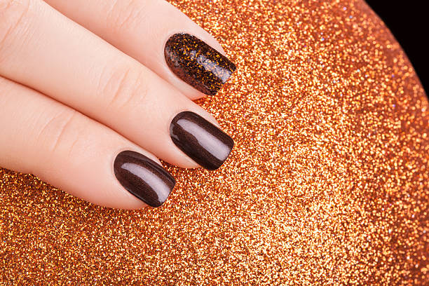 istock Brown nail polish. 498840684