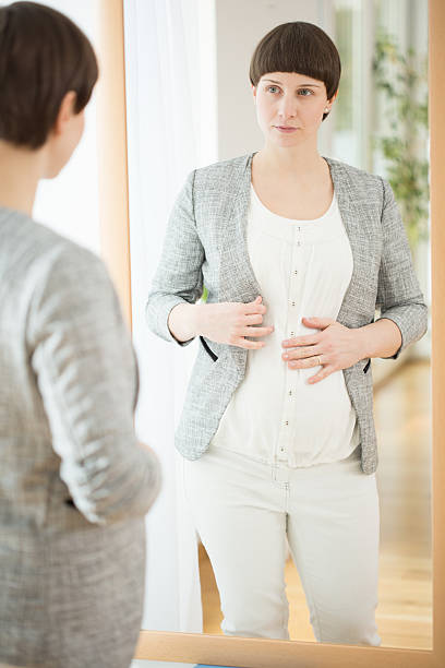 istock Dressing up pregnant woman 498842634