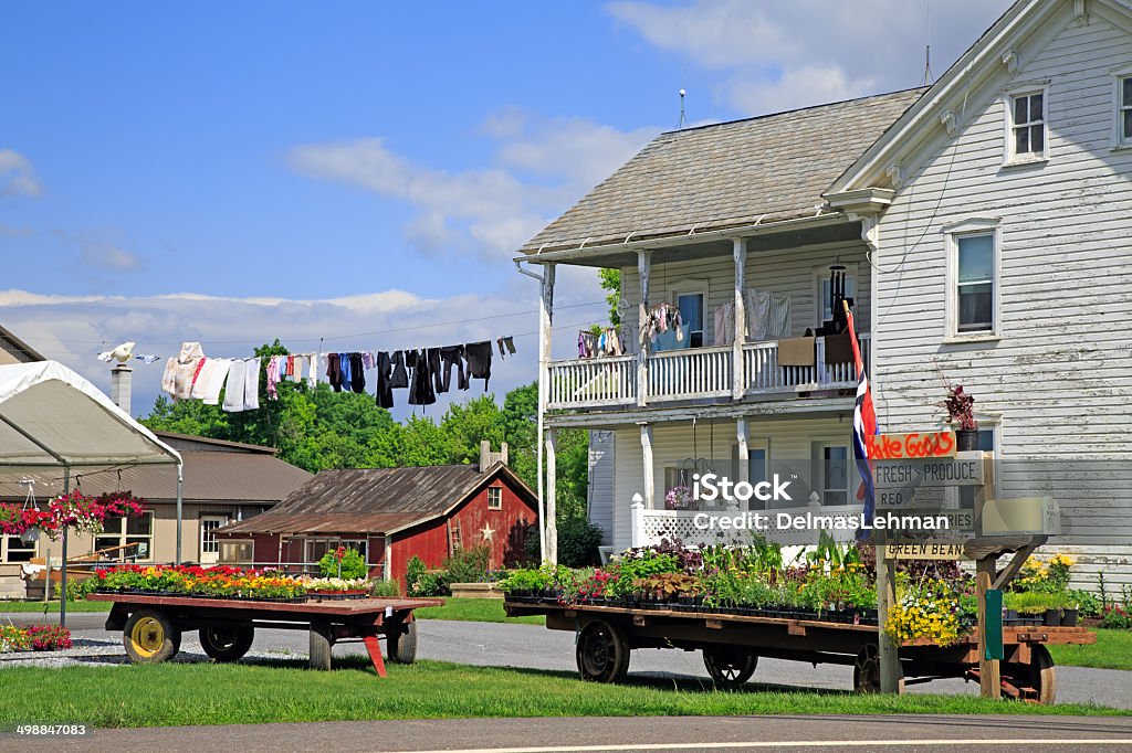 Amish Roadside Market An Amish roadside market in rural, Lancaster County, Pennsylvania.Clothing is hung on a pulley line for drying after being washed. Amish Stock Photo