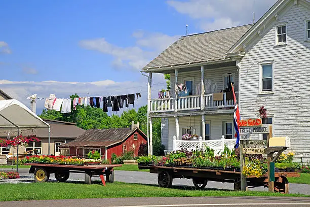 An Amish roadside market in rural, Lancaster County, Pennsylvania.Clothing is hung on a pulley line for drying after being washed.