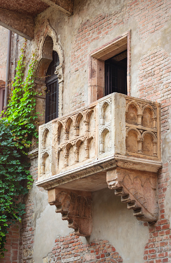 VERONA, ITALY - FEBRUARY 10, 2018: Juliet's house and balcony from William Shakespeare drama Romeo and Juliet