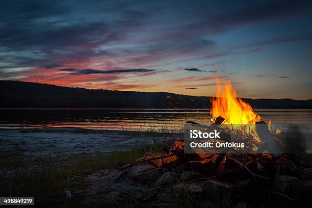 Summer Campfire And Lake At Sunset Stock Photo - Download Image Now - Campfire, Nature, Friendship