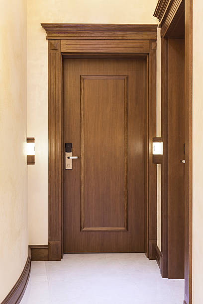 istock Wooden door with number light in hotel 498852881