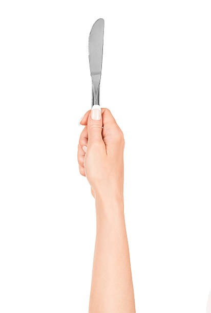 istock hand holding a knife on an isolated white background 498853151