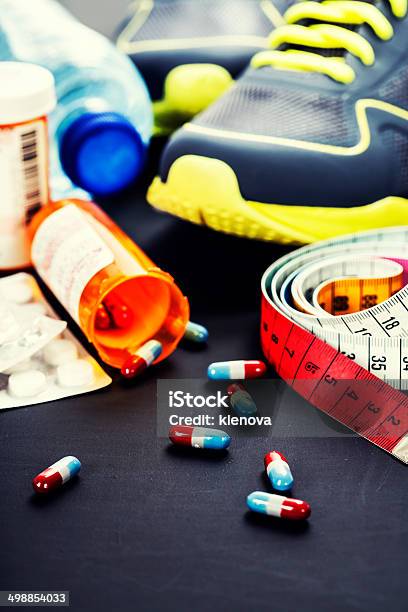 Different Tools For Sport And Pills Stock Photo - Download Image Now - Anaerobic Exercise, Blue, Body Building