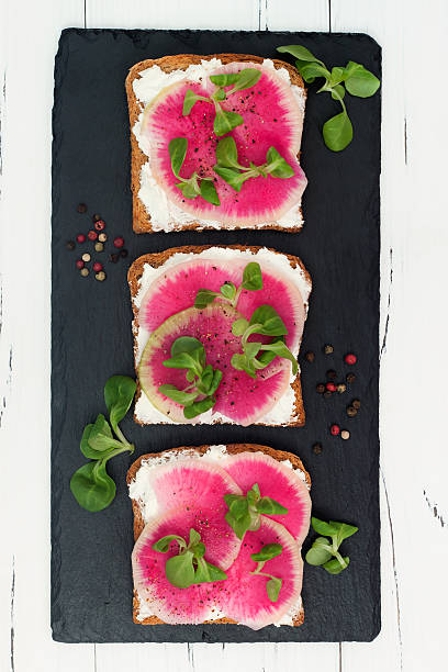 istock Bruschetta with goat cheese, watermelon radish and corn salad 498855766