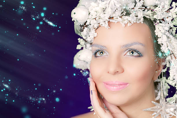 istock Winter Queen with white magical hairstyle and beauty makeup 498857384