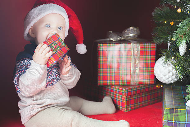 istock Happy surprised baby holding gift box, present, Christmas, eve 498857664