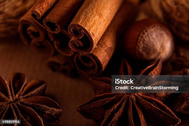 Cinnamon Anise And Nuts On A Brown Background Stock Photo - Download Image Now - 2015, Advent, Anise