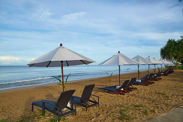 Beach chair setup with umbrella stock photo