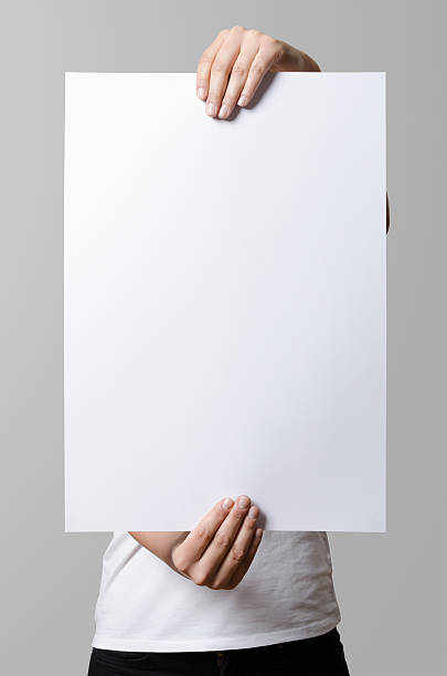 Woman holding a blank poster, square 35x50, mock up.