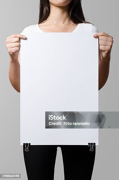 Woman Holding A Blank Poster Square 35x50 Mock Up Stock Photo - Download Image Now