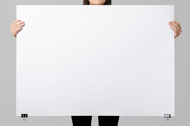 istock Woman holding a blank poster, square 100x70, mock up. 498860528
