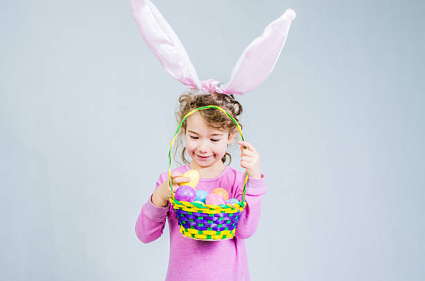 istock Little easter pink bunny girl 498862064