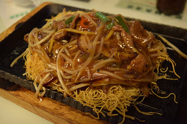 istock Chow mein on hot plate. 498862066