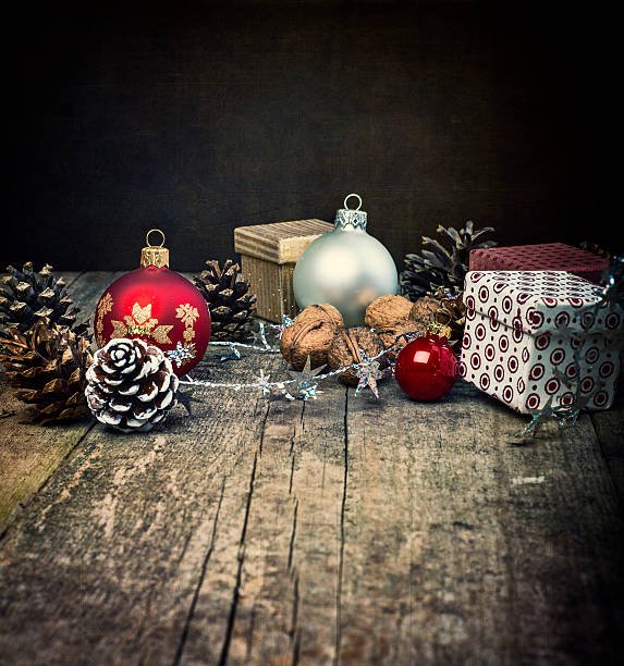istock Festive Gifts with Boxes, Baubles, Cones, Walnuts on Wooden Background. 498862712