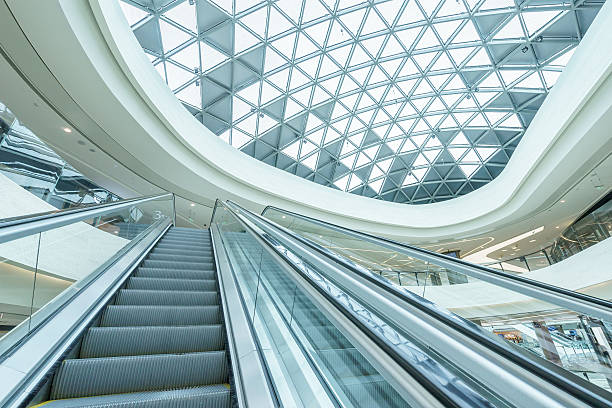 istock abstract ceiling and escalator in hall of shopping mall 498863248