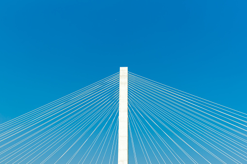 Structural abstract of Veterans Memorial stay bridge against blue sky across the Mississippi River in St Louis, Illinois, USA