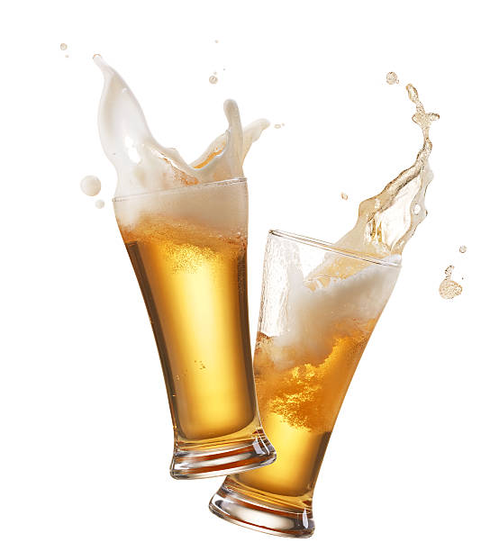 toasting two glasses of beer toasting creating splash celebratory toast stock pictures, royalty-free photos & images