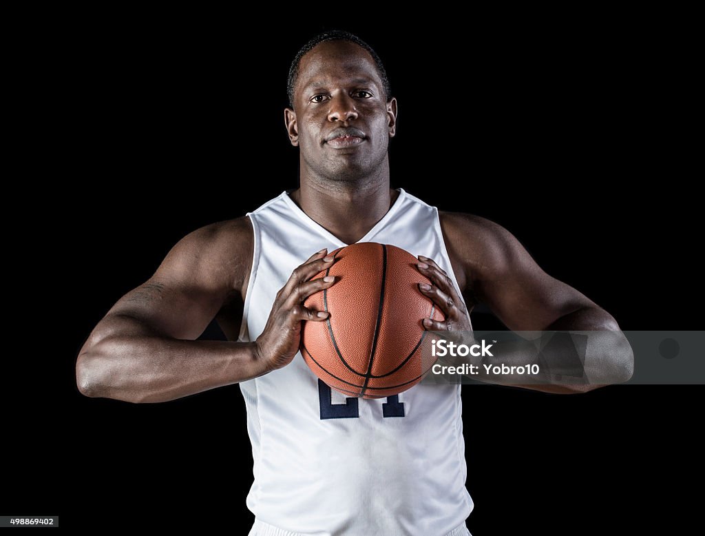 1970s AFRICAN AMERICAN MAN BASKETBALL PLAYER HOLDING BALL Stock Photo -  Alamy