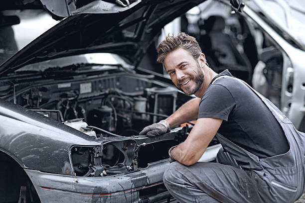 istock Male mechanic fixing car 498879060