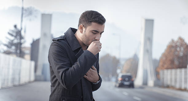 Man coughing stock photo
