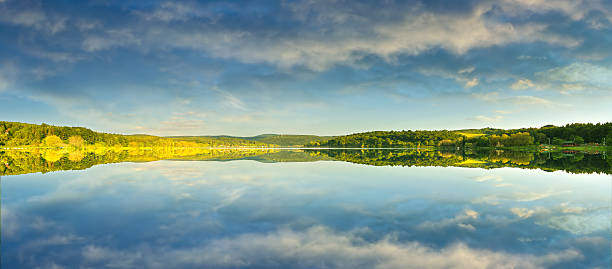istock Beautiful yellow rape field, reflected in the lake, 498881699