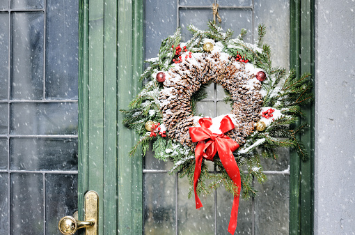 entrance decorated with homemade christmas wreath
