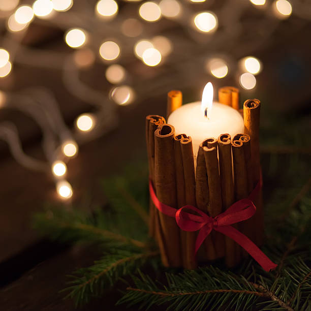 istock Christmas candle and ornaments over dark background with lights 498882686